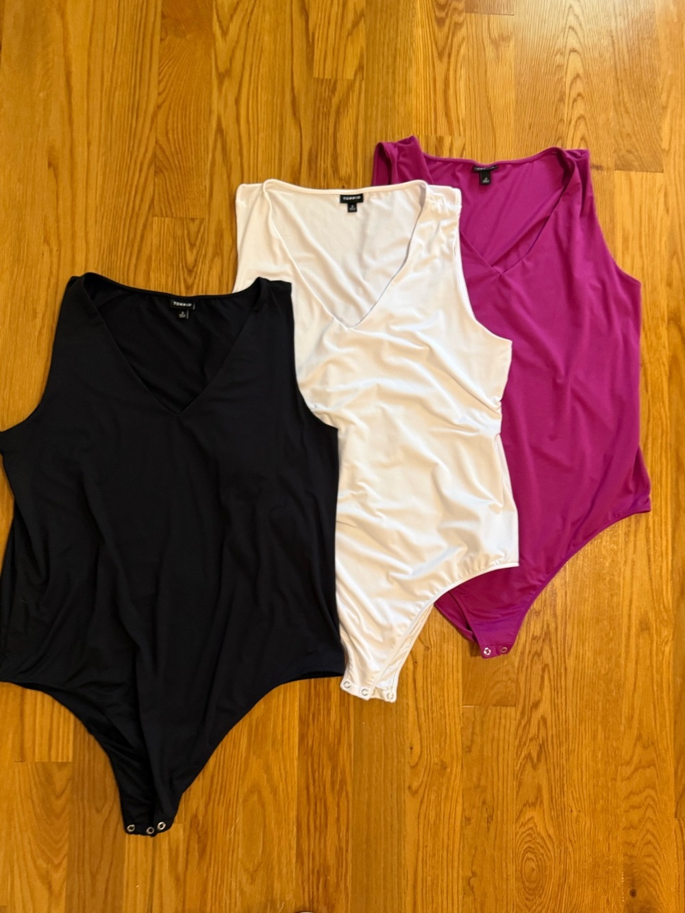 Size 3 torrid Sleeveless V-Neck Bodysuit 3 pack - Black, White, Fuchsia